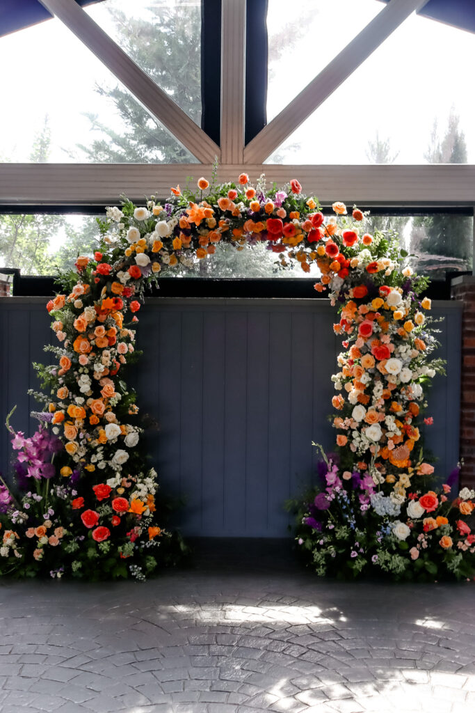 park loft wedding florist - garden in the pines - bright ceremony arch